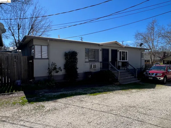 a house view with a garden space