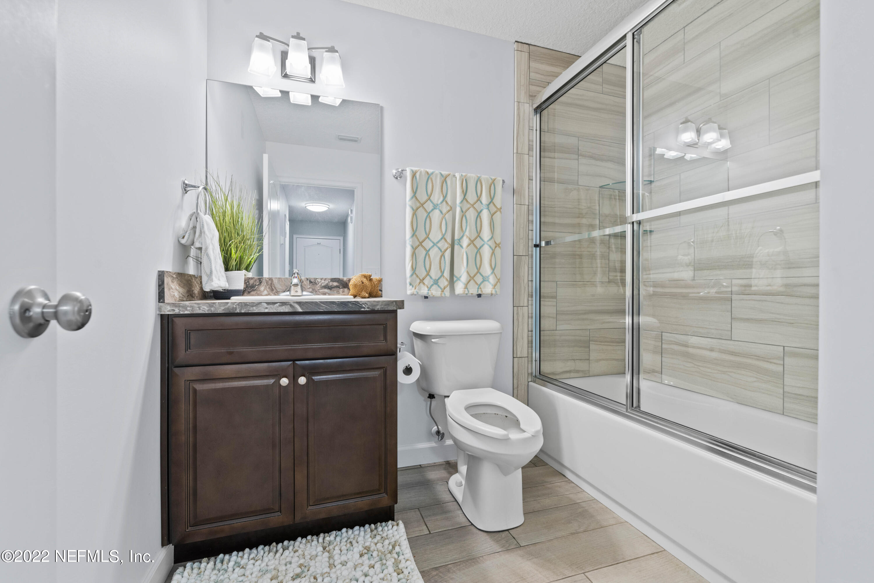 6434 Cabana Trace Starke, FL 32091 - Photo 15 of 38 a bathroom with a sink toilet and shower