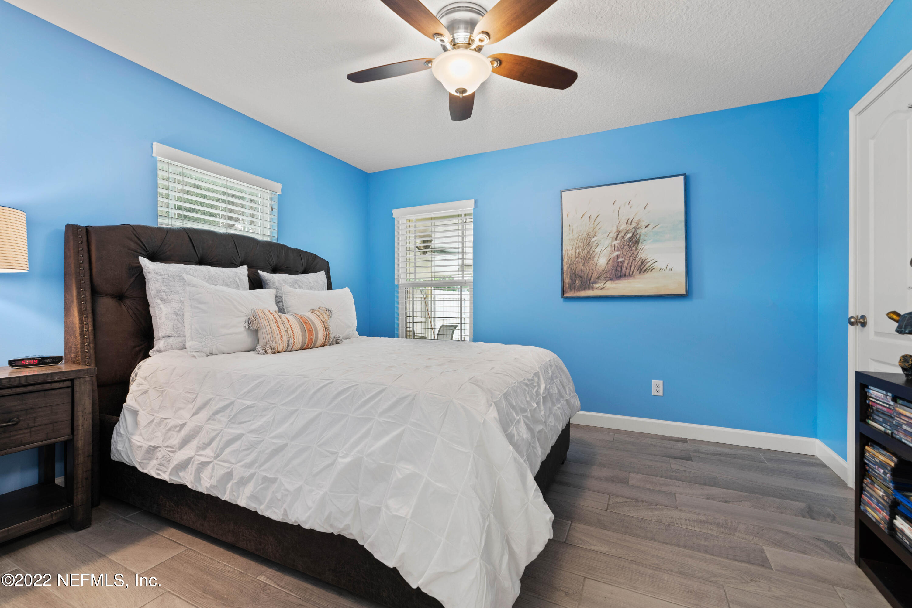 6434 Cabana Trace Starke, FL 32091 - Photo 18 of 38 a bedroom with a bed and a painting on the wall