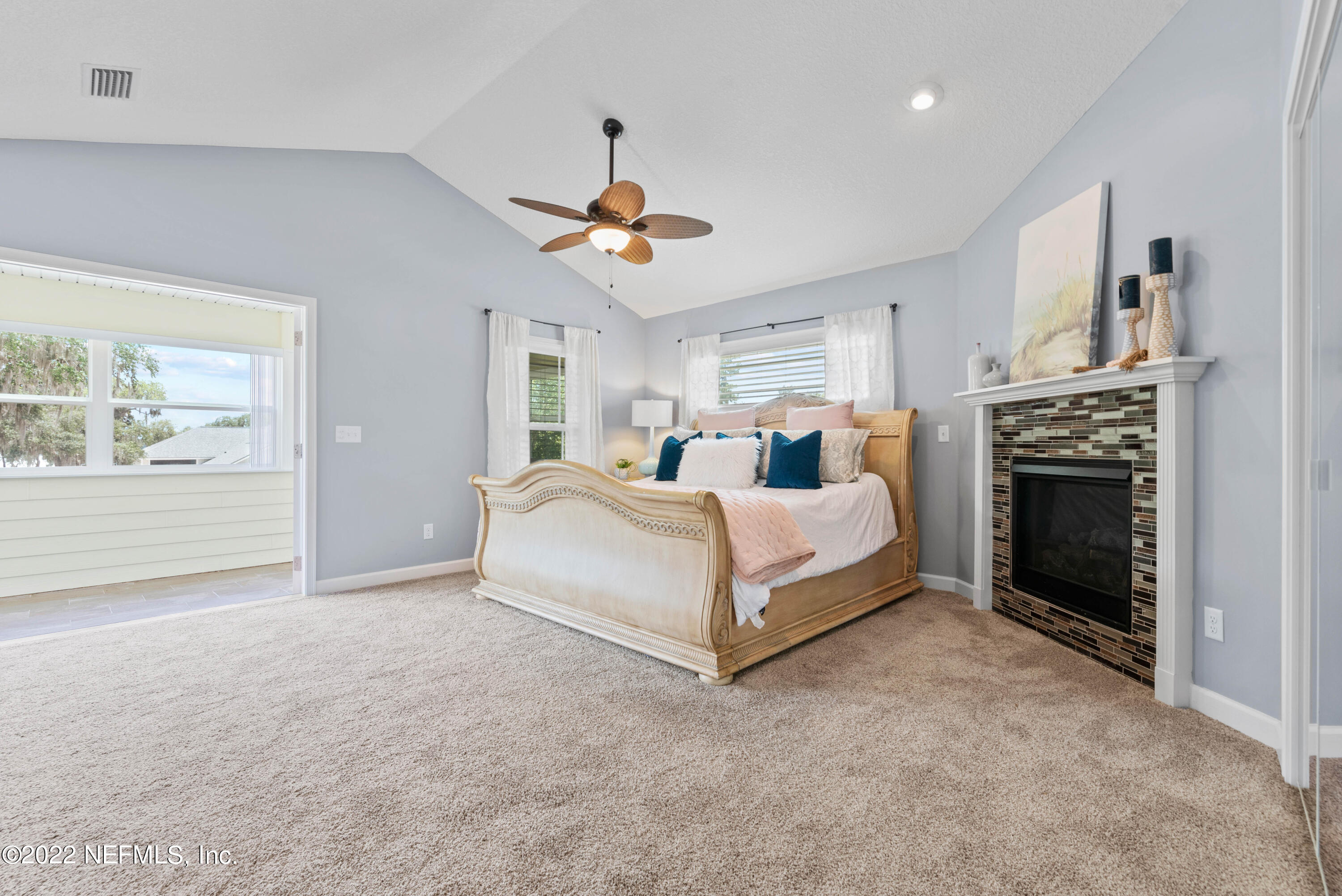 6434 Cabana Trace Starke, FL 32091 - Photo 20 of 38 a bed room with a bed and a fireplace