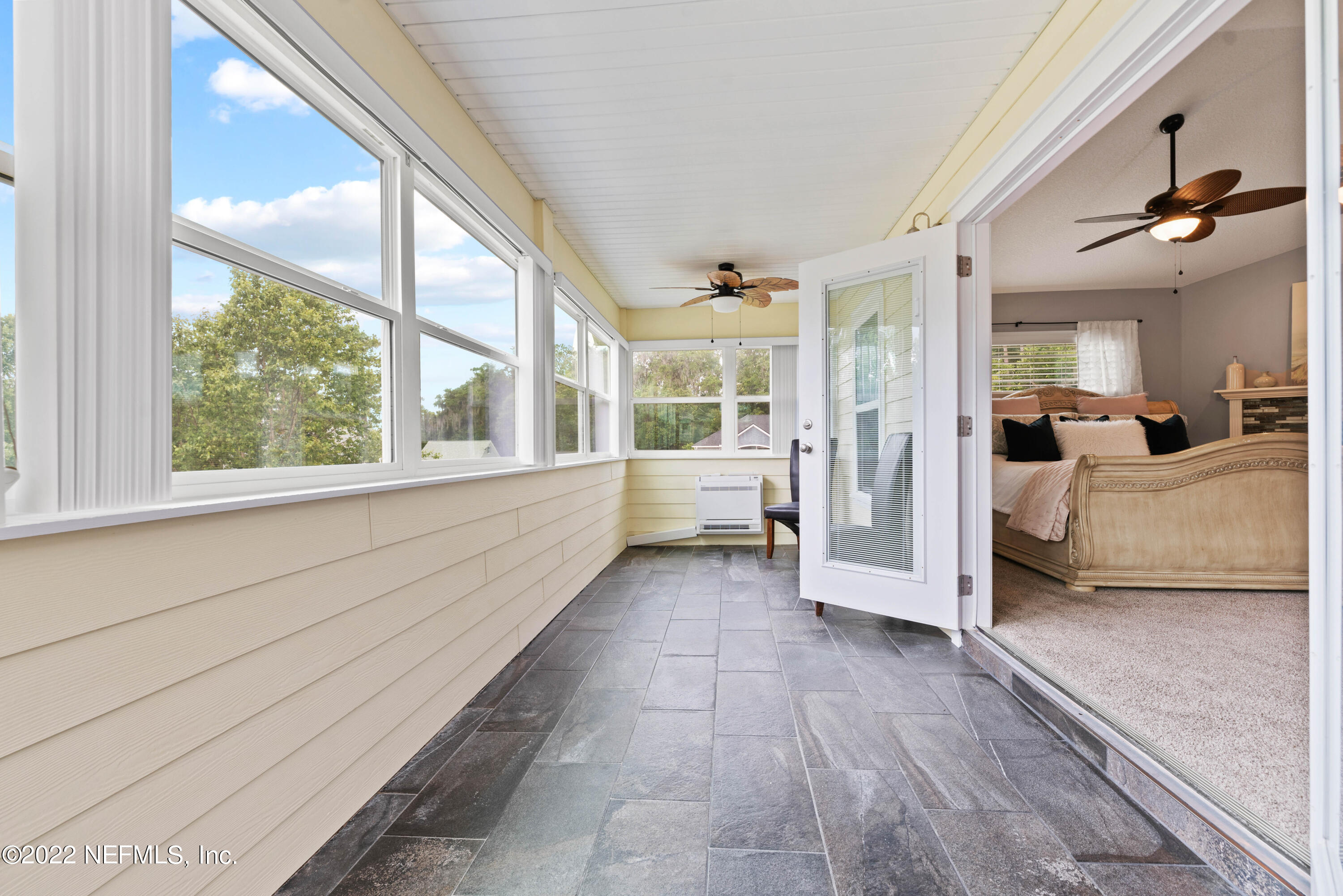 6434 Cabana Trace Starke, FL 32091 - Photo 24 of 38 a view of a bedroom with furniture and large windows