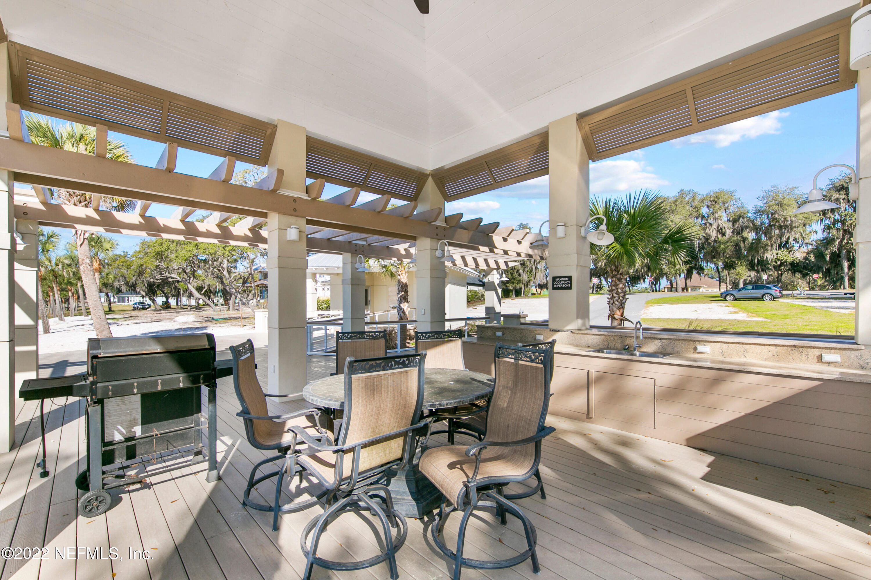 6434 Cabana Trace Starke, FL 32091 - Photo 33 of 38 a dining room with furniture water view and large windows