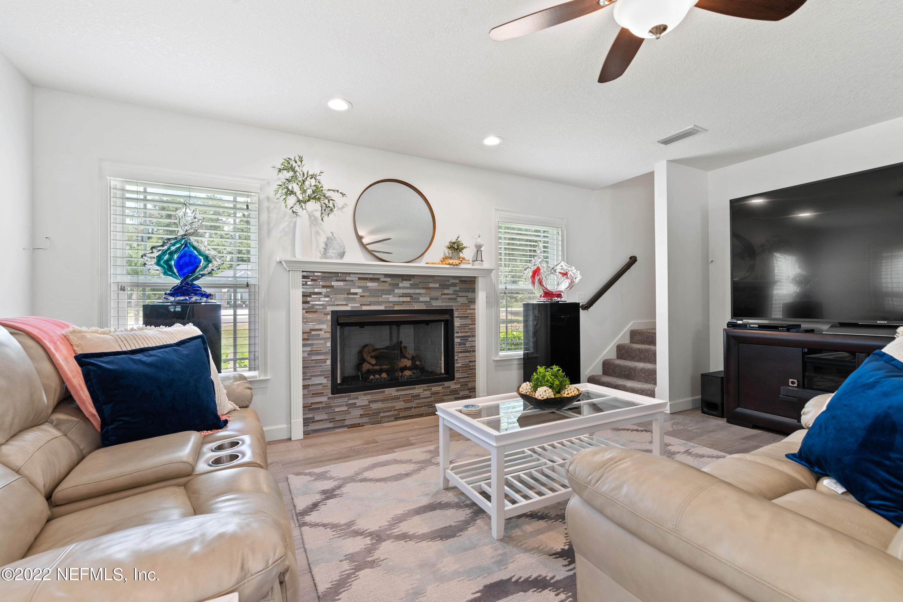 6434 Cabana Trace Starke, FL 32091 - Photo 9 of 38 a living room with furniture and a fireplace