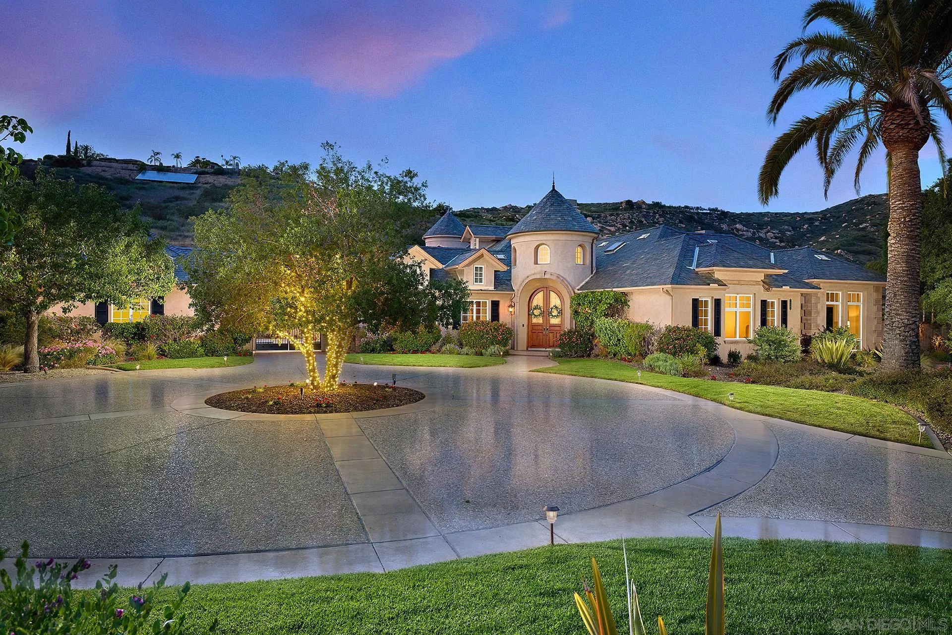 a view of a house with outdoor space and sitting area