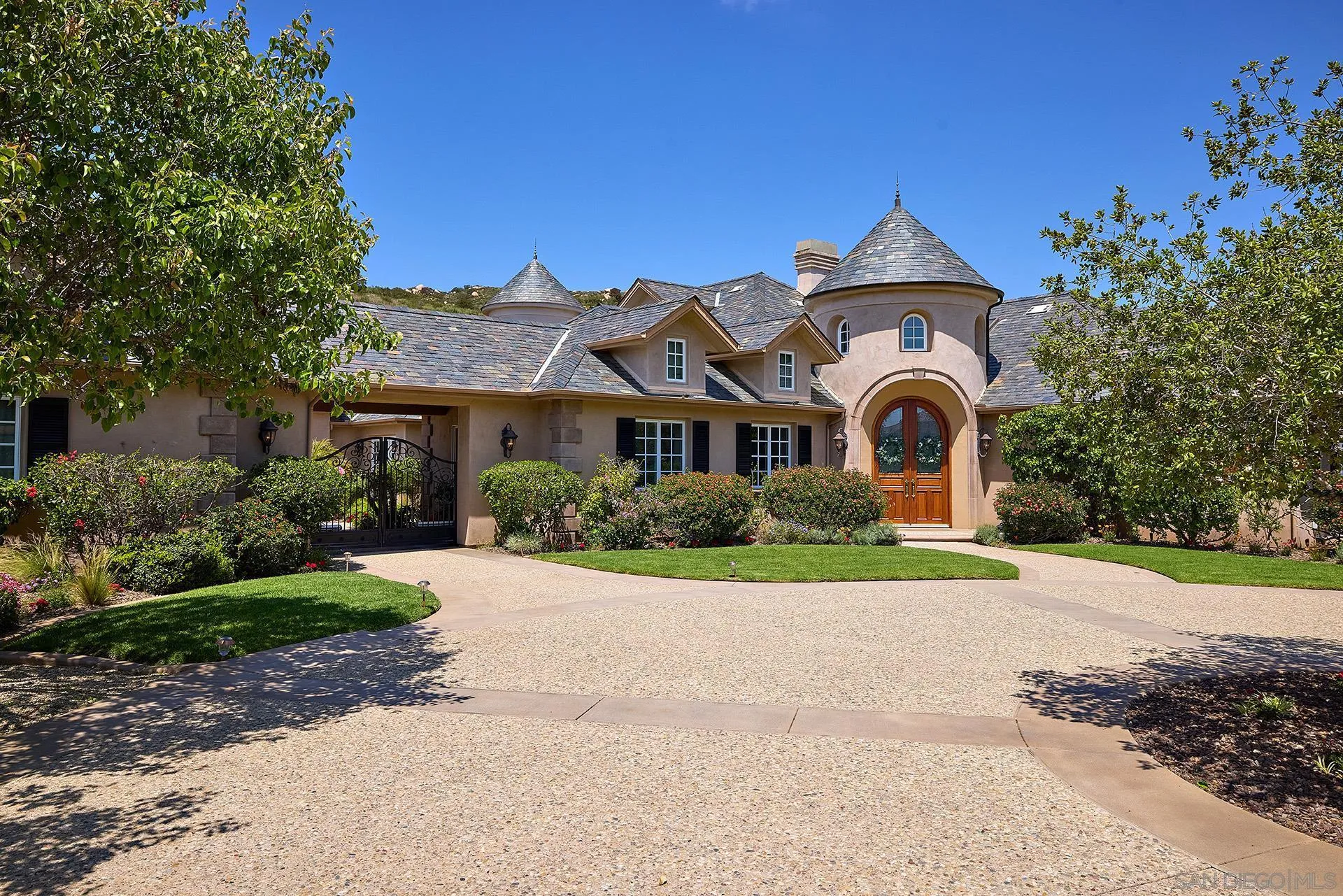 14460 Cheyenne Trail Poway, CA 92064 - Photo 13 of 74 a front view of a house with a yard and garage
