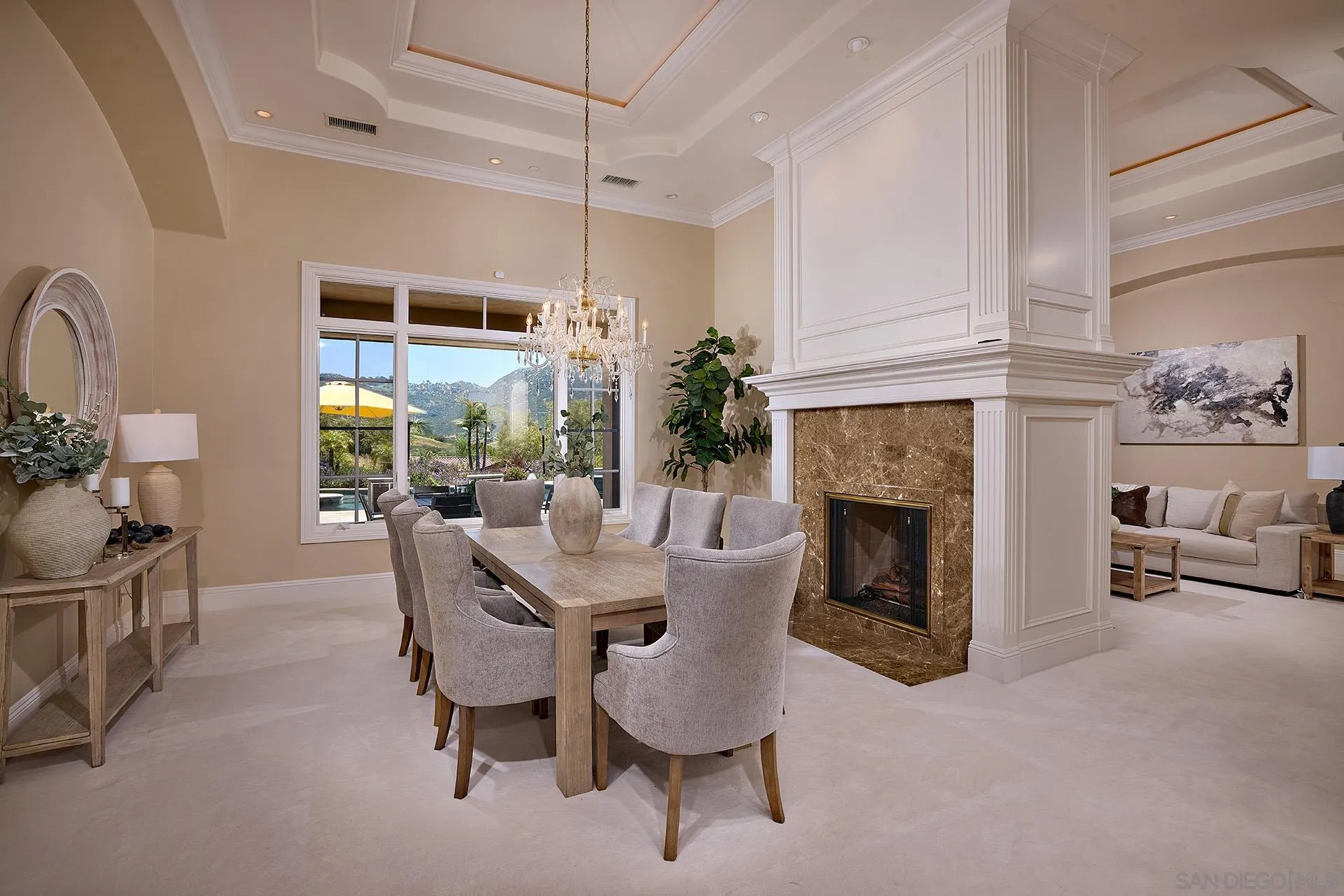 14460 Cheyenne Trail Poway, CA 92064 - Photo 20 of 74 a dining room with furniture a fireplace and wooden floor