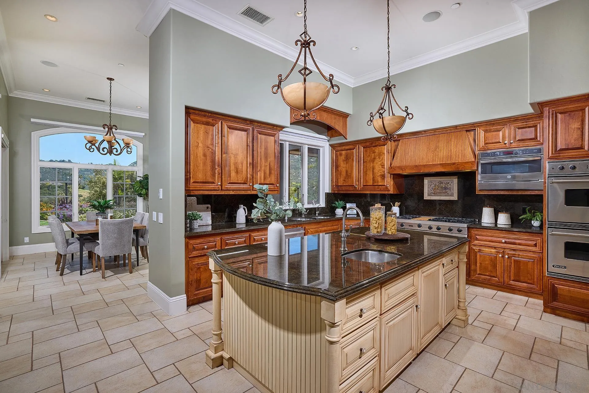 14460 Cheyenne Trail Poway, CA 92064 - Photo 27 of 74 a kitchen with stainless steel appliances granite countertop a sink a stove and a refrigerator