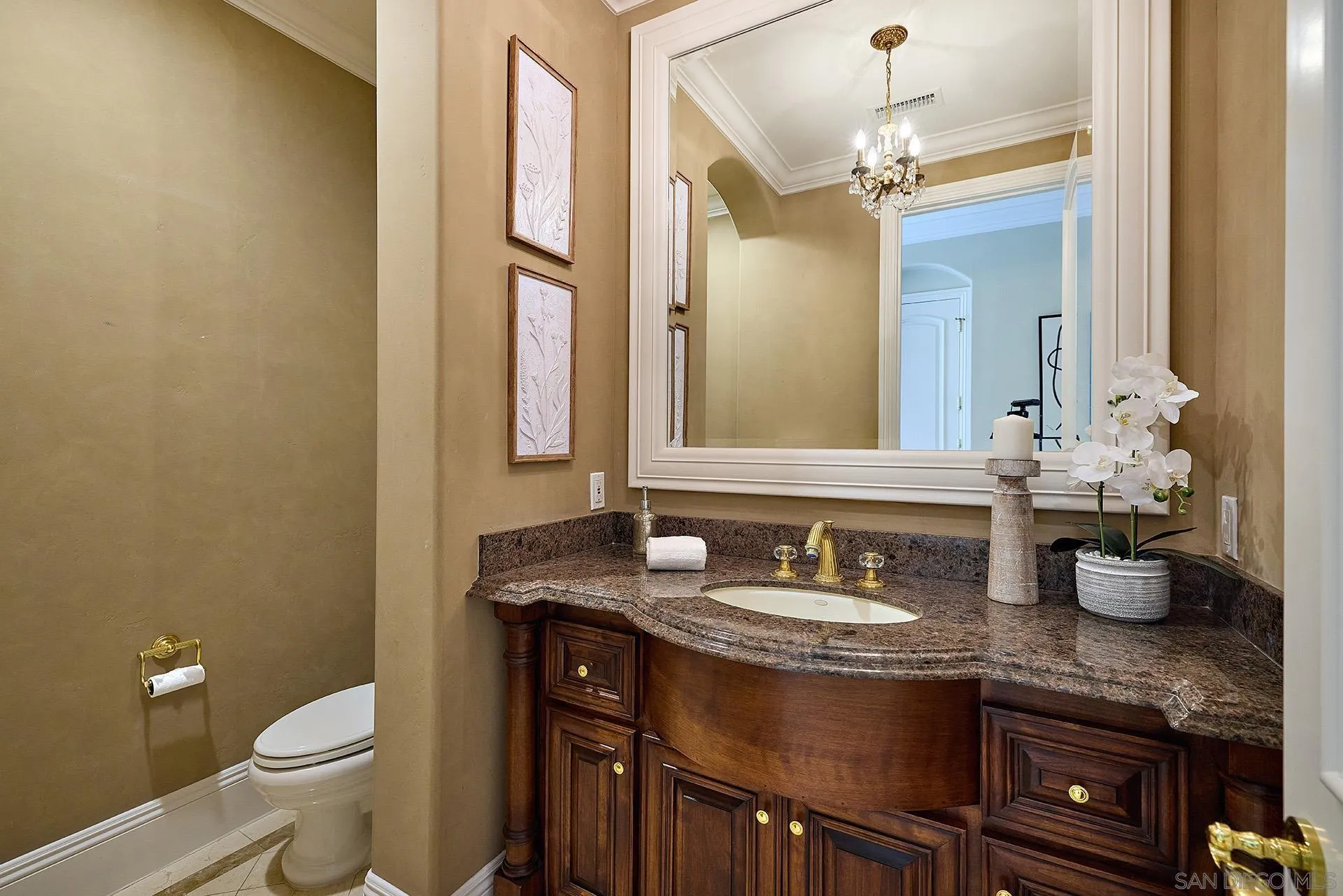 14460 Cheyenne Trail Poway, CA 92064 - Photo 30 of 74 a bathroom with a granite countertop sink a toilet and a mirror