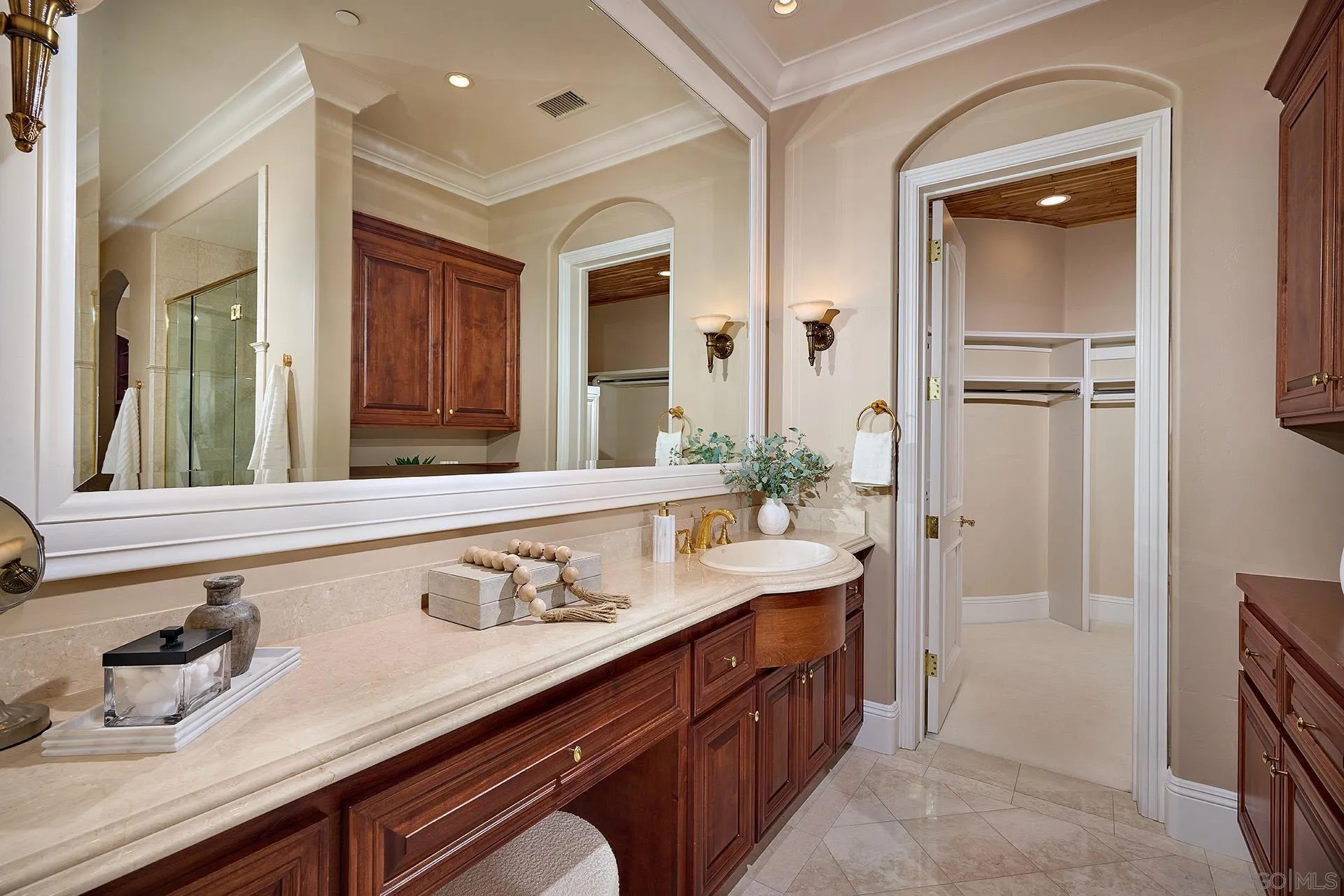 14460 Cheyenne Trail Poway, CA 92064 - Photo 35 of 74 a spacious bathroom with a granite countertop sink and a mirror