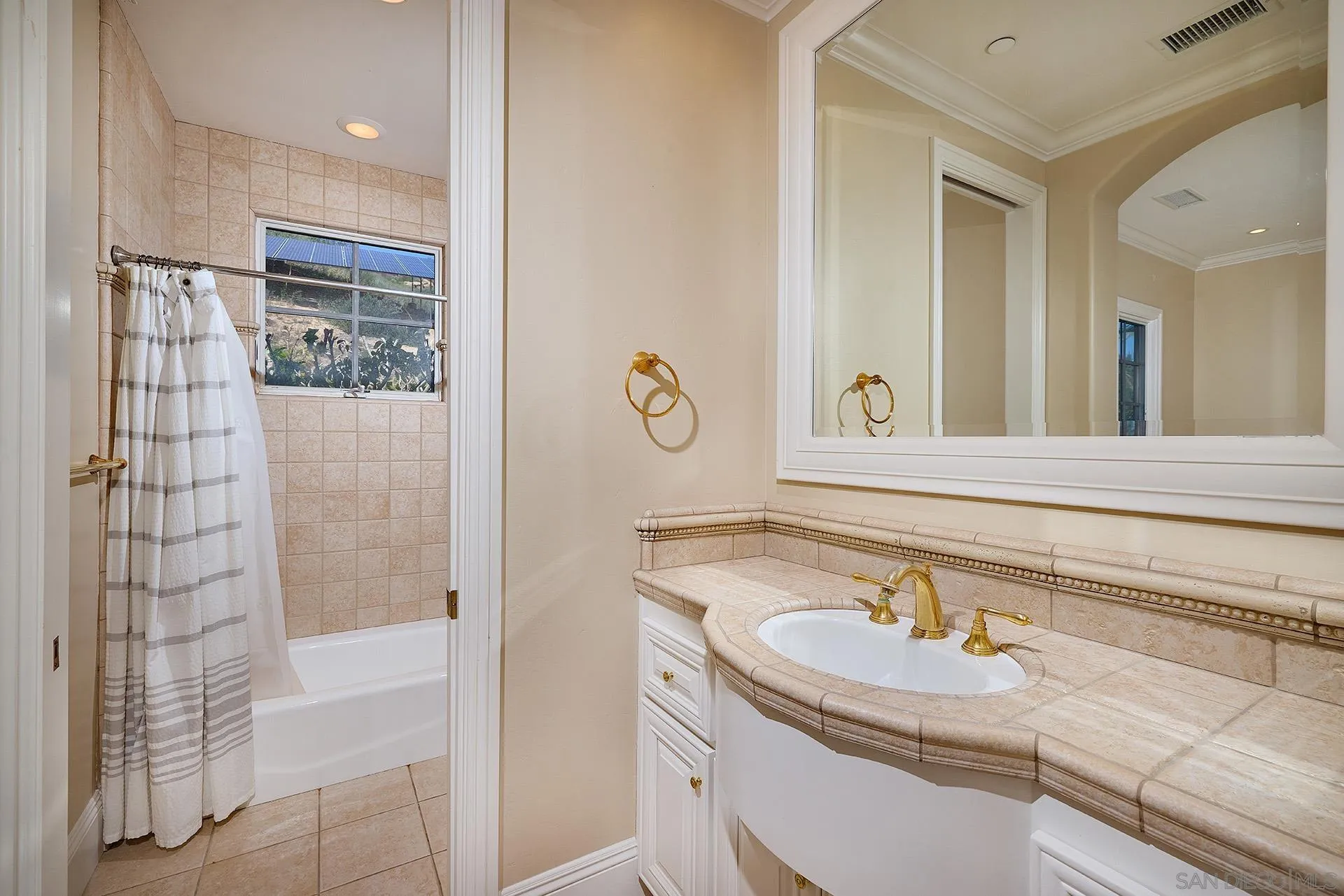 14460 Cheyenne Trail Poway, CA 92064 - Photo 42 of 74 a bathroom with a sink and a shower