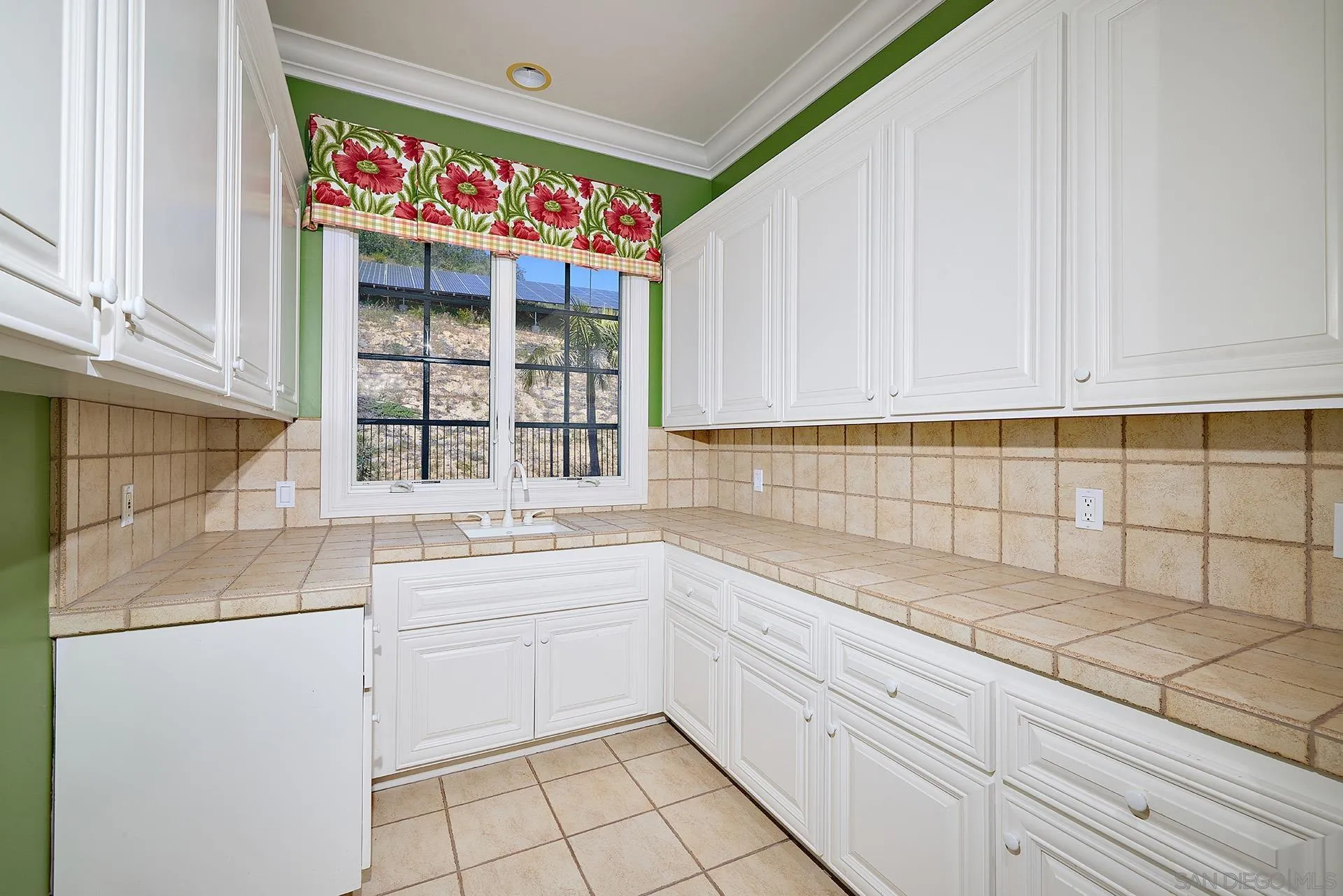14460 Cheyenne Trail Poway, CA 92064 - Photo 44 of 74 a kitchen with a sink cabinets and window
