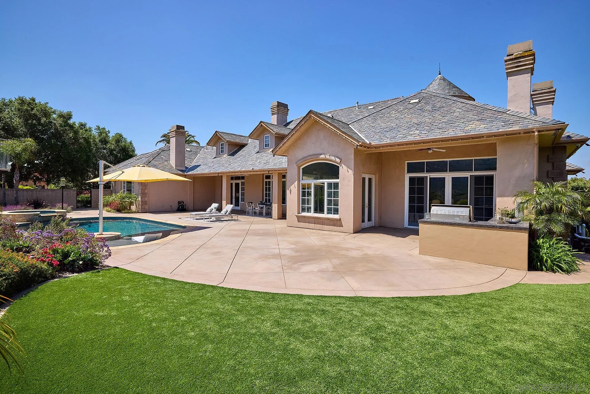 14460 Cheyenne Trail Poway, CA 92064 - Photo 45 of 74 a front view of a house with a yard and garage