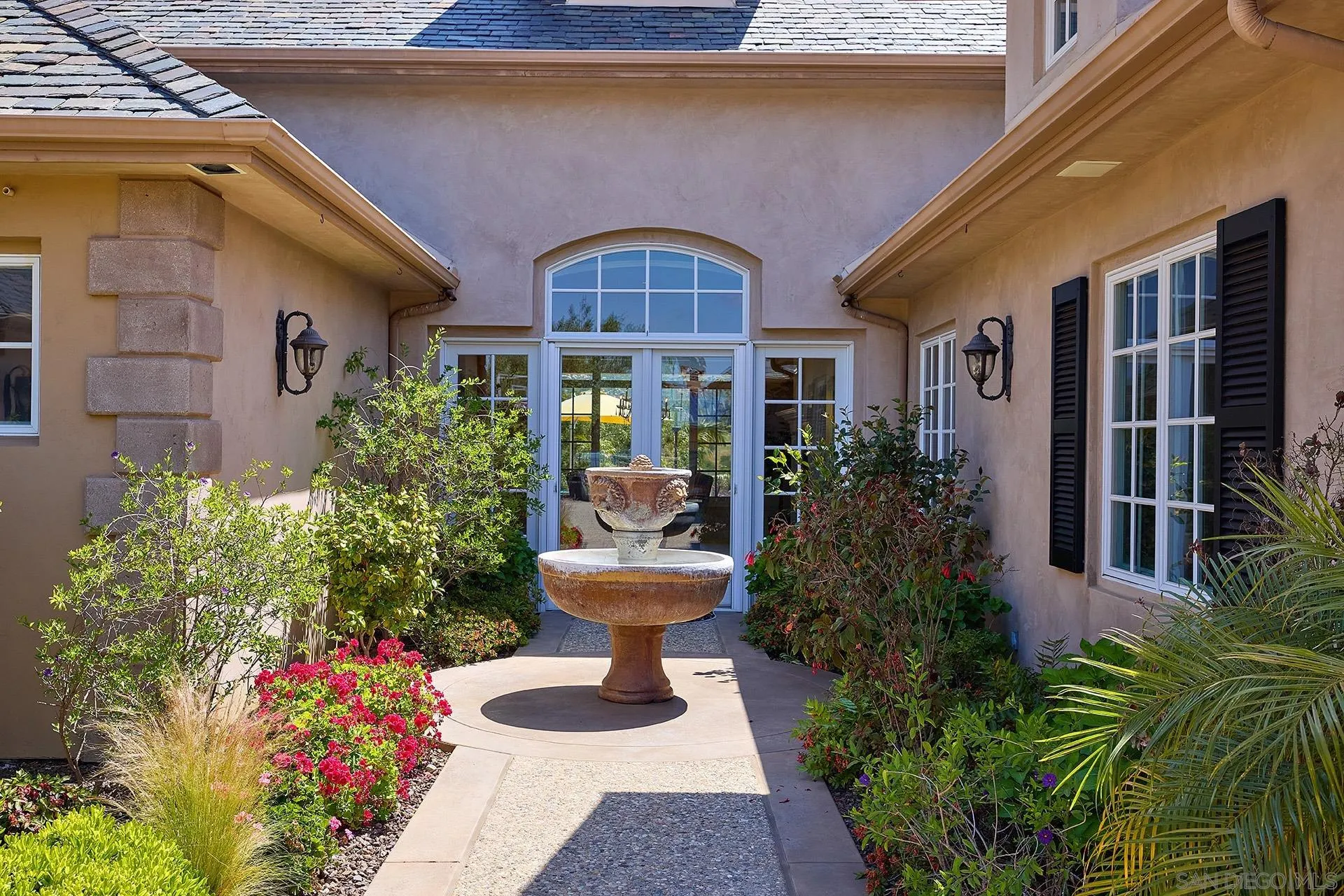 14460 Cheyenne Trail Poway, CA 92064 - Photo 49 of 74 a front view of a house with outdoor seating and plants