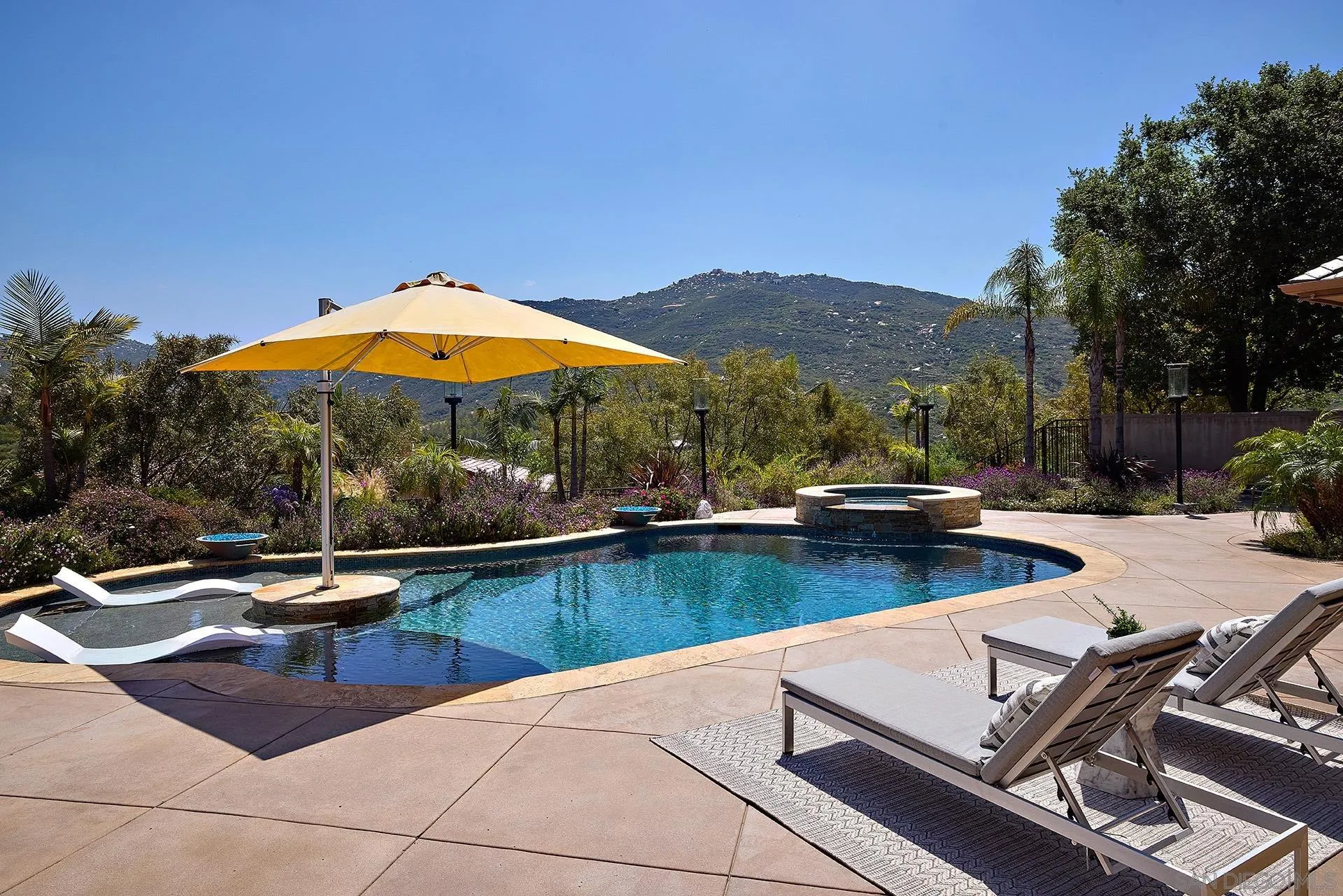 14460 Cheyenne Trail Poway, CA 92064 - Photo 50 of 74 a view of a swimming pool with lounge chairs
