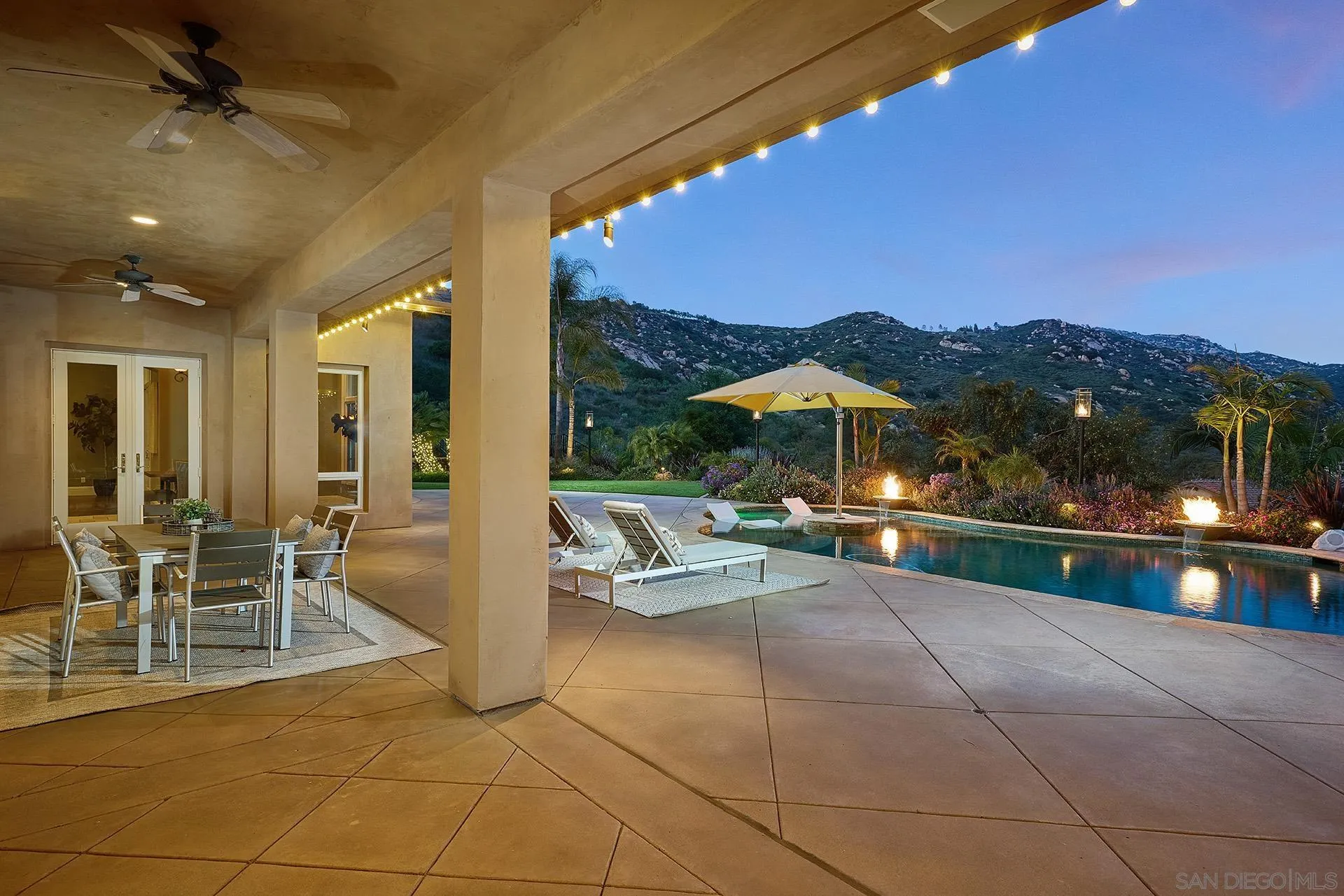 14460 Cheyenne Trail Poway, CA 92064 - Photo 5 of 74 a view of a patio with dining table and chairs with a barbeque grill and plants
