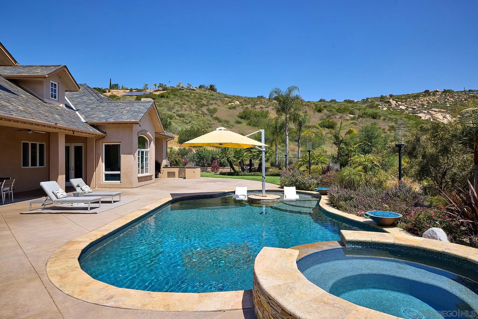 14460 Cheyenne Trail Poway, CA 92064 - Photo 53 of 74 a view of a swimming pool with lounge chairs
