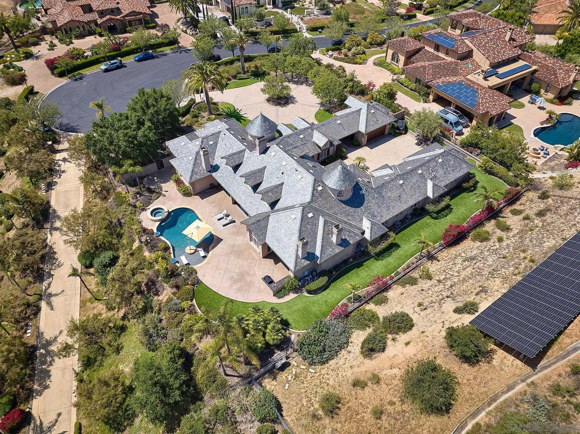 14460 Cheyenne Trail Poway, CA 92064 - Photo 58 of 74 an aerial view of a house with a garden and swimming pool