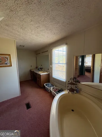 a room with gym equipment and windows