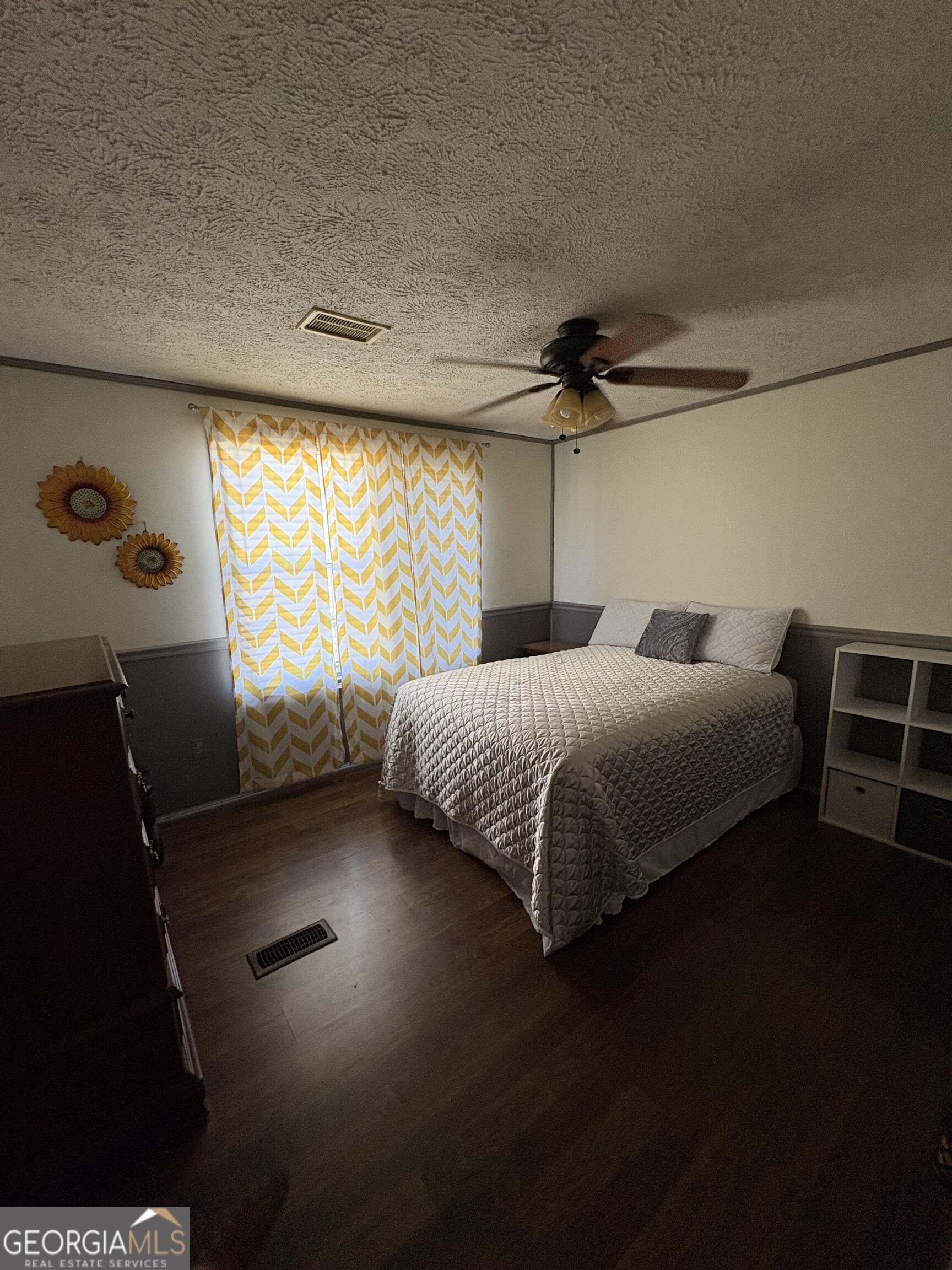 314 Cedar Creek Road Harrison, GA 31035 - Photo 16 of 20 a bedroom with a bed and a window