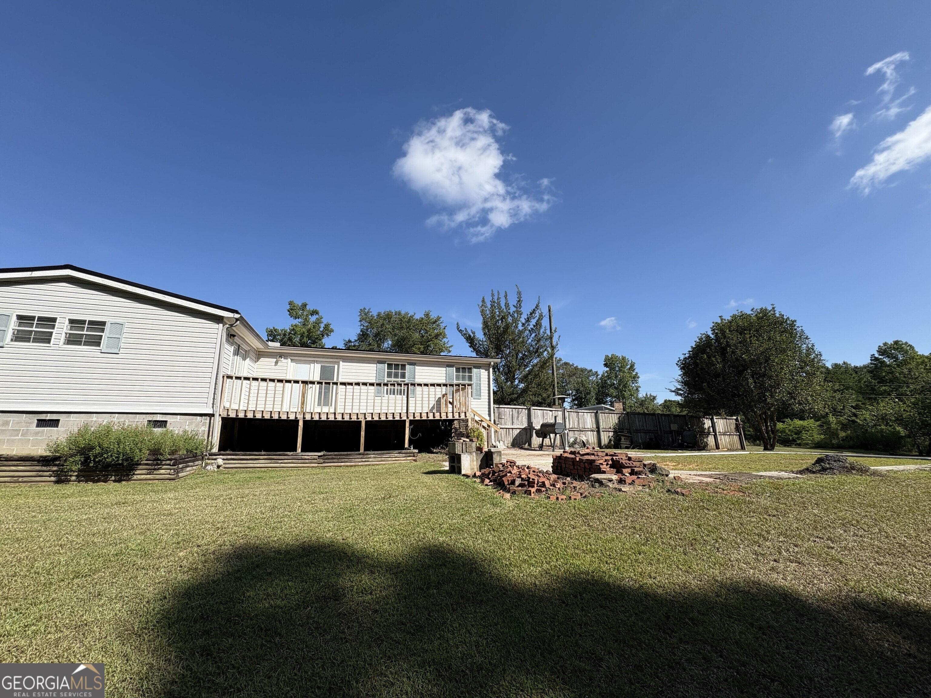 314 Cedar Creek Road Harrison, GA 31035 - Photo 19 of 20 a view of a house with a backyard porch and sitting area