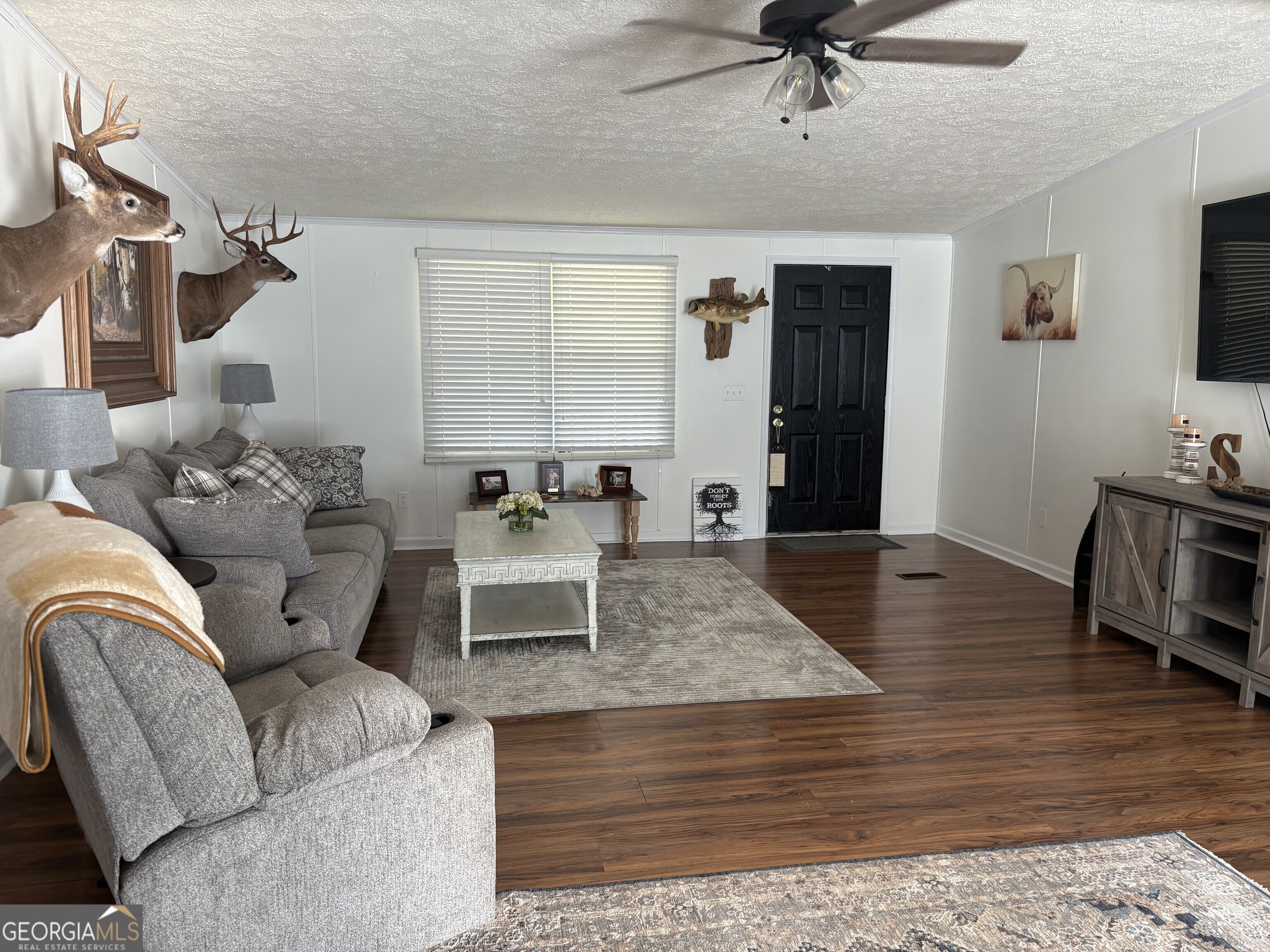 314 Cedar Creek Road Harrison, GA 31035 - Photo 4 of 20 a living room with furniture and a wooden floor