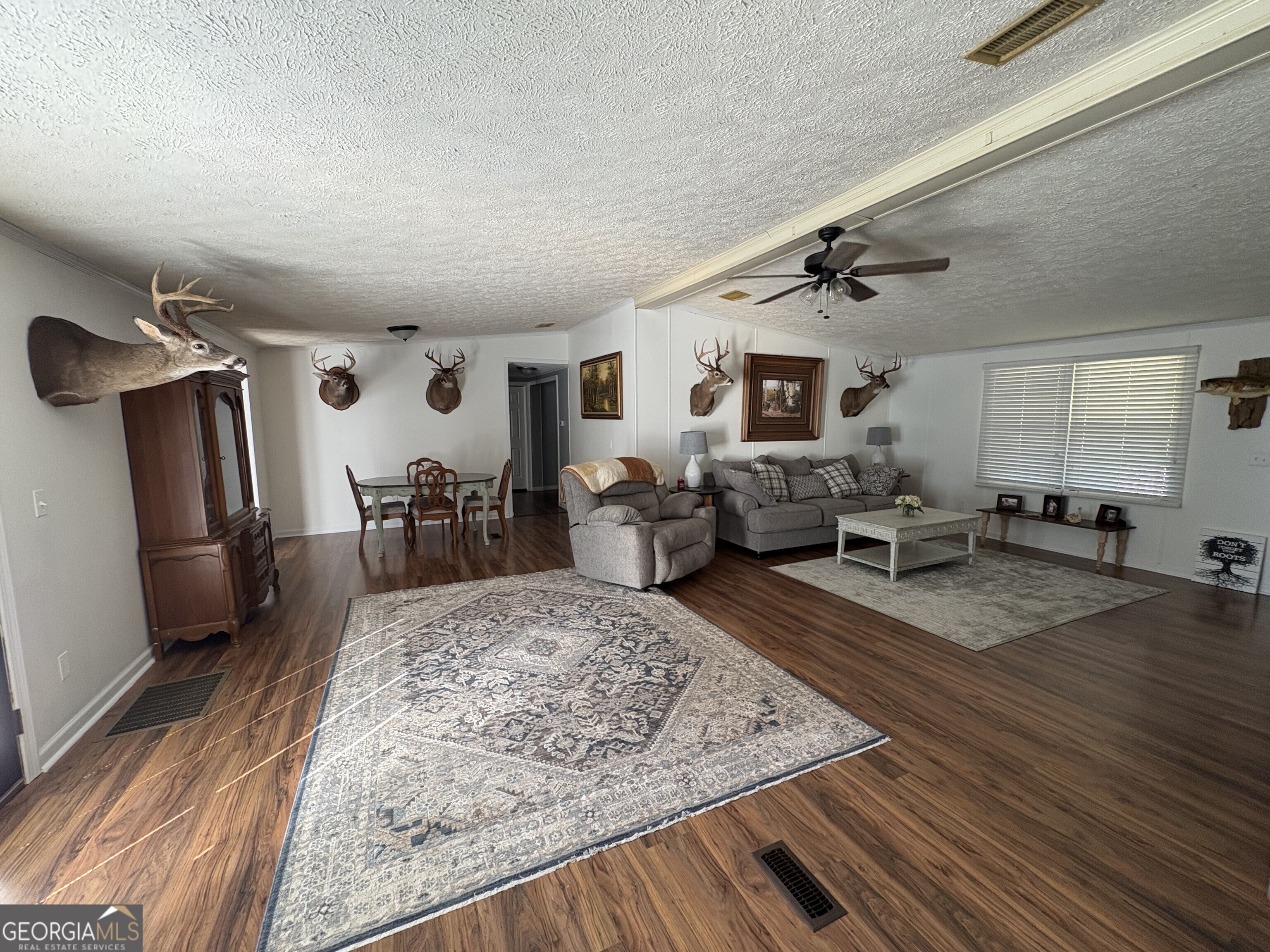 314 Cedar Creek Road Harrison, GA 31035 - Photo 6 of 20 a living room with furniture and a wooden floor