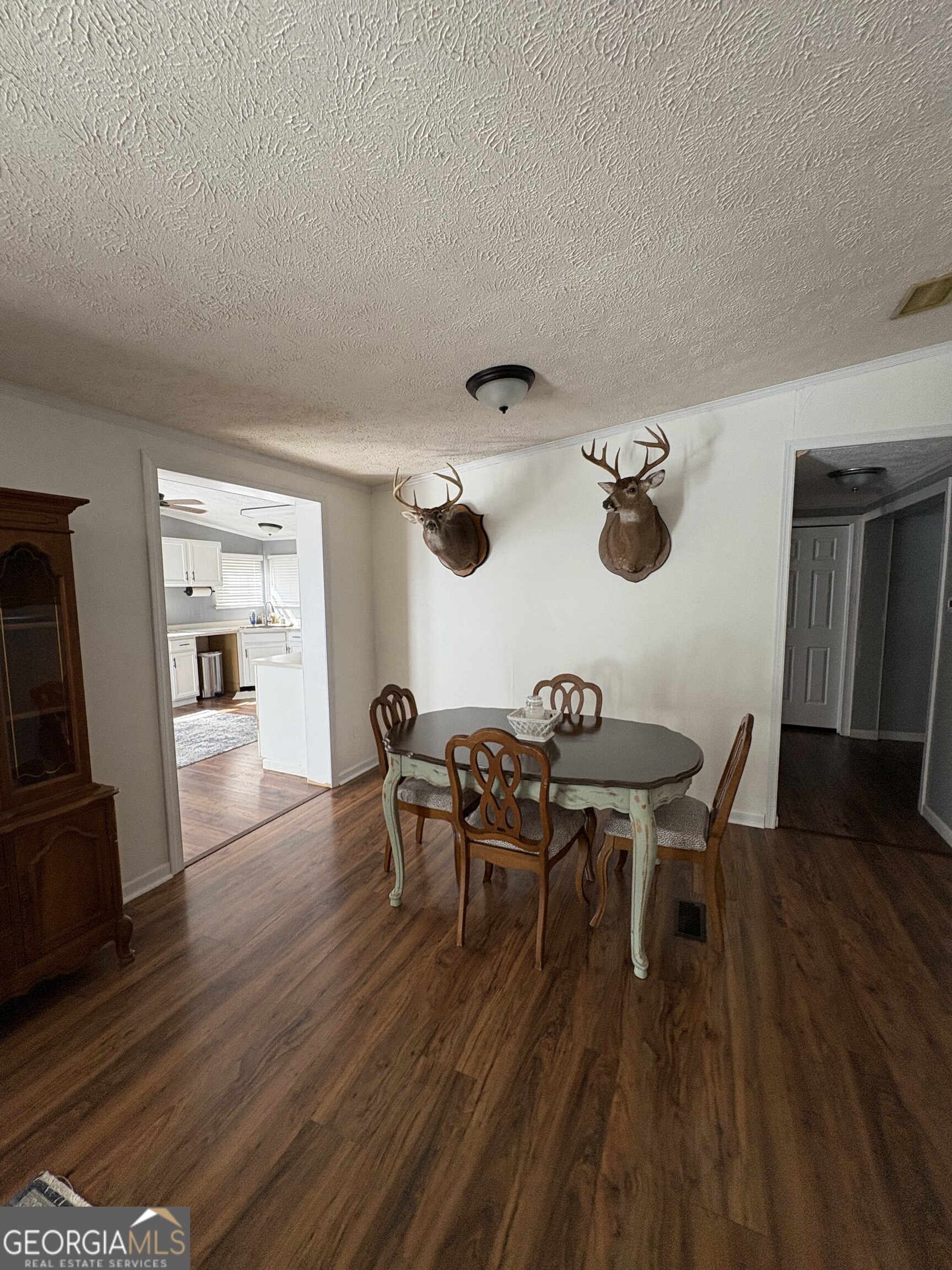 314 Cedar Creek Road Harrison, GA 31035 - Photo 7 of 20 a view of a dining room with furniture and wooden floor