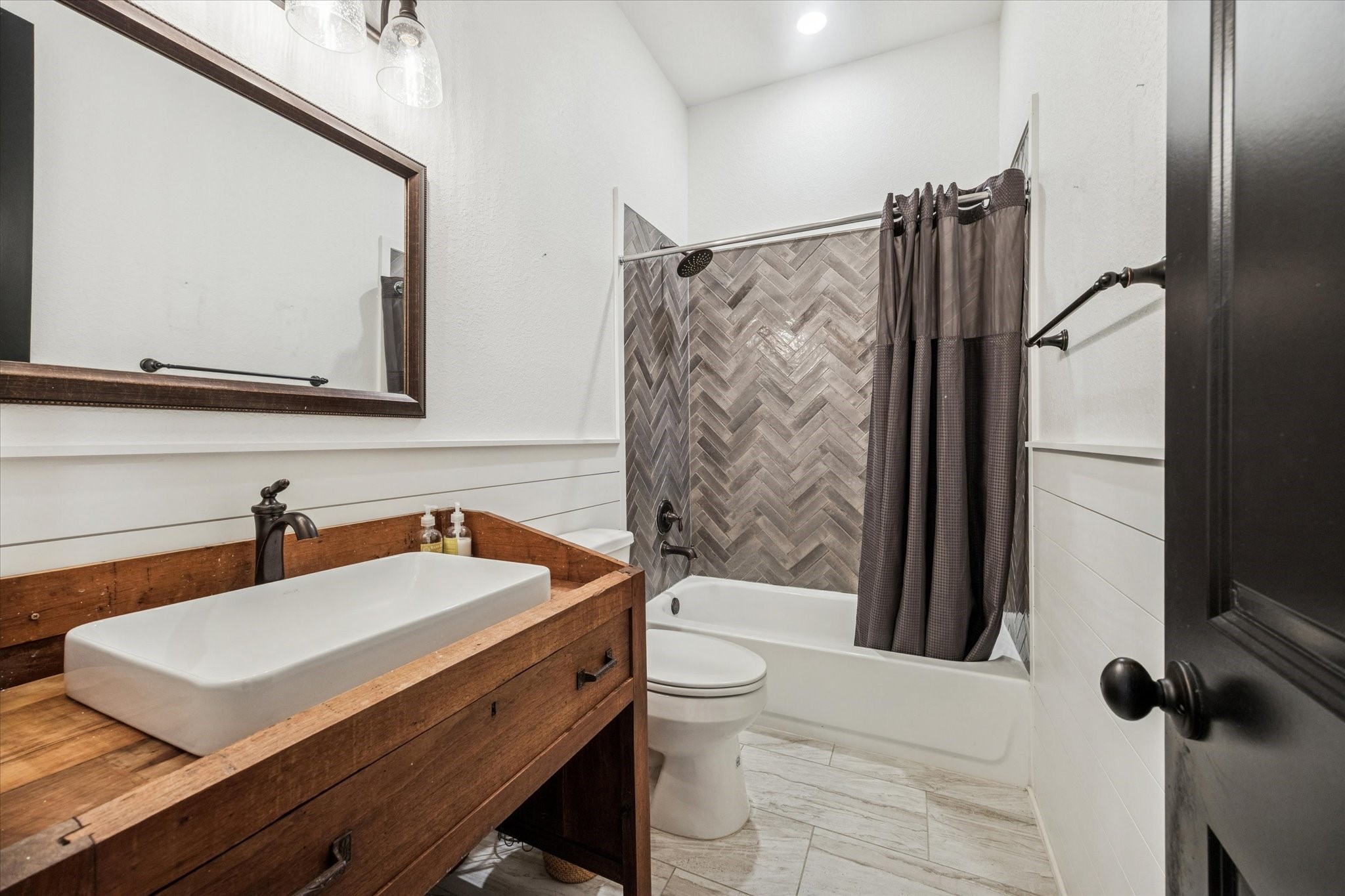 124 REBEKAHS Crossing Round Top, TX 78954 - Photo 13 of 25 a bathroom with a sink a toilet a mirror and shower