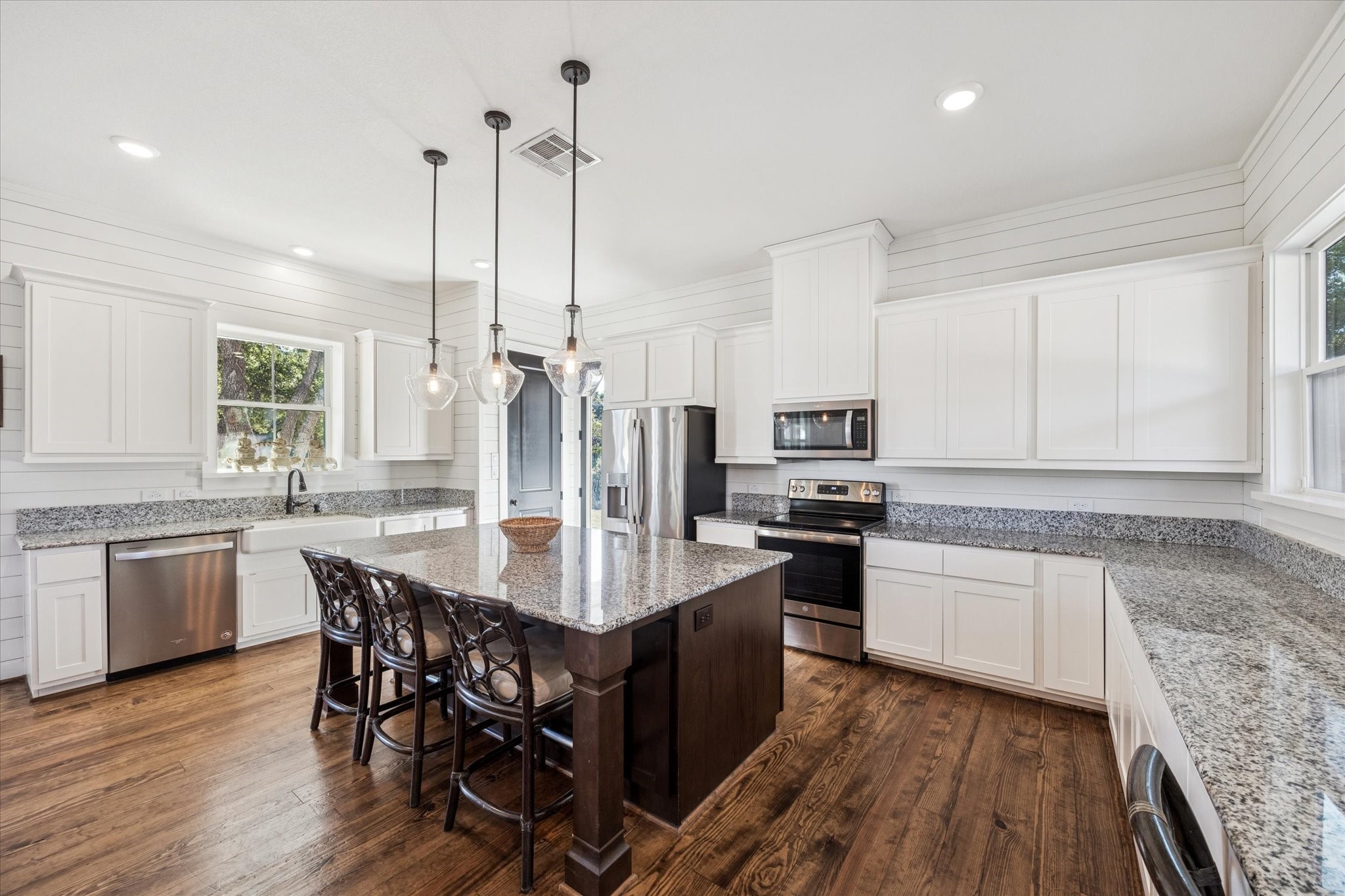 124 REBEKAHS Crossing Round Top, TX 78954 - Photo 6 of 25 a kitchen with stainless steel appliances granite countertop a kitchen island a stove a table and chairs