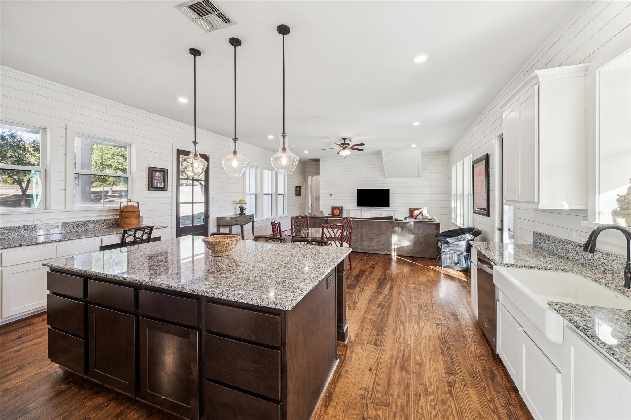 124 REBEKAHS Crossing Round Top, TX 78954 - Photo 7 of 25 a kitchen with stainless steel appliances granite countertop sink stove and wooden floor