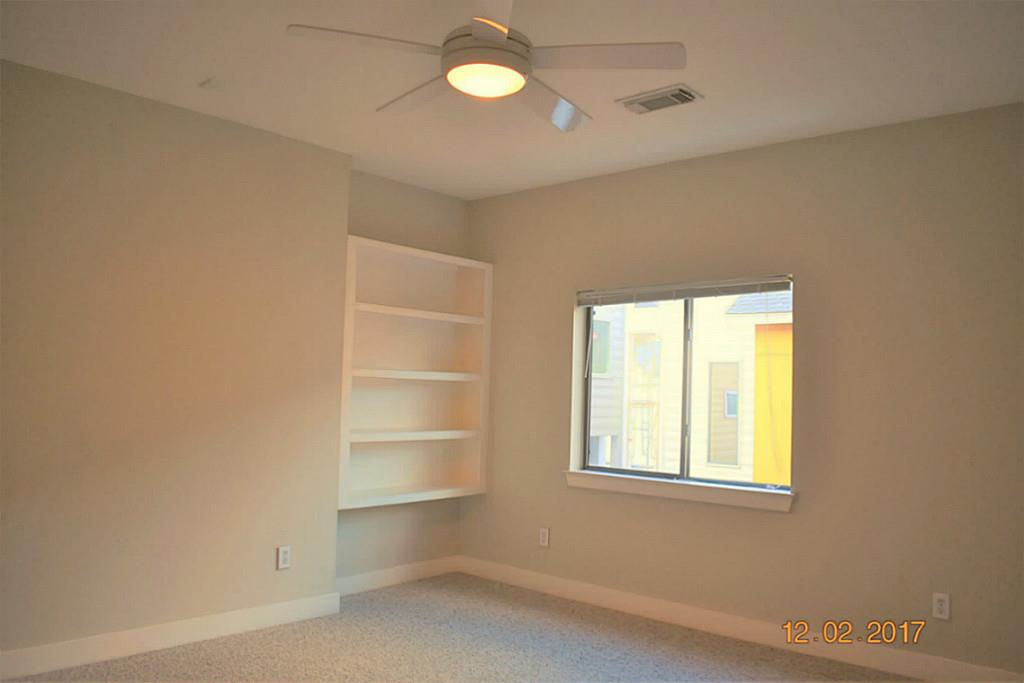 4338 Spencer Street Houston, TX 77007 - Photo 10 of 23 Room next to master bedroom with built in shelves for home office or additional storage