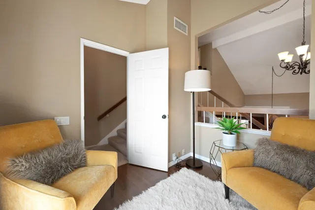 a balcony with table and chairs