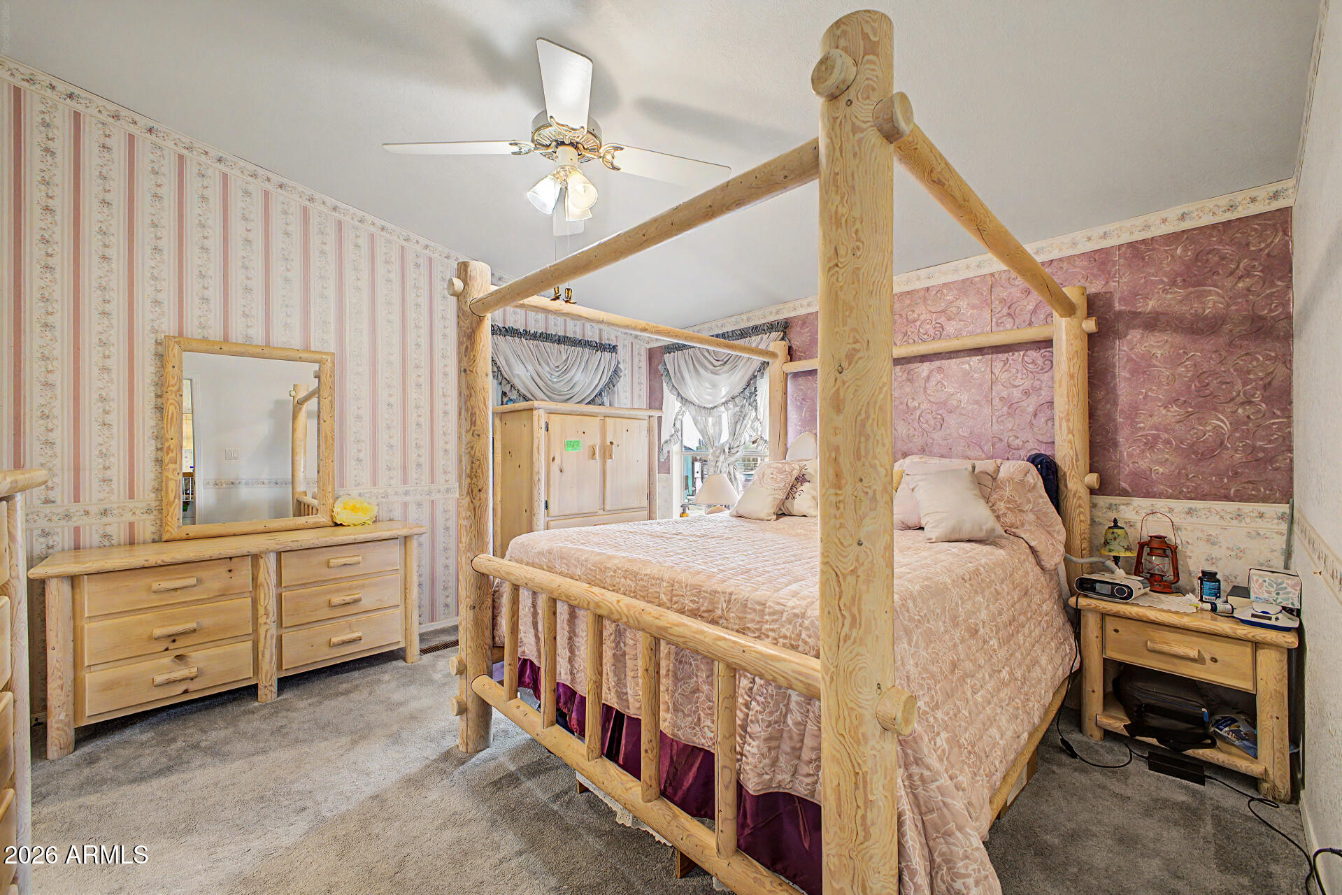 2548 South Val Vista Road Apache Junction, AZ 85119 - Photo 22 of 29 a bedroom with a bed and large windows