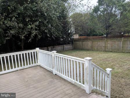 8023 Clark Station Road Severn, MD 21144 - Photo 12 of 21 Deck Leads out to Large Yard