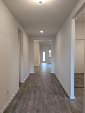 a view of gallery with wooden floor