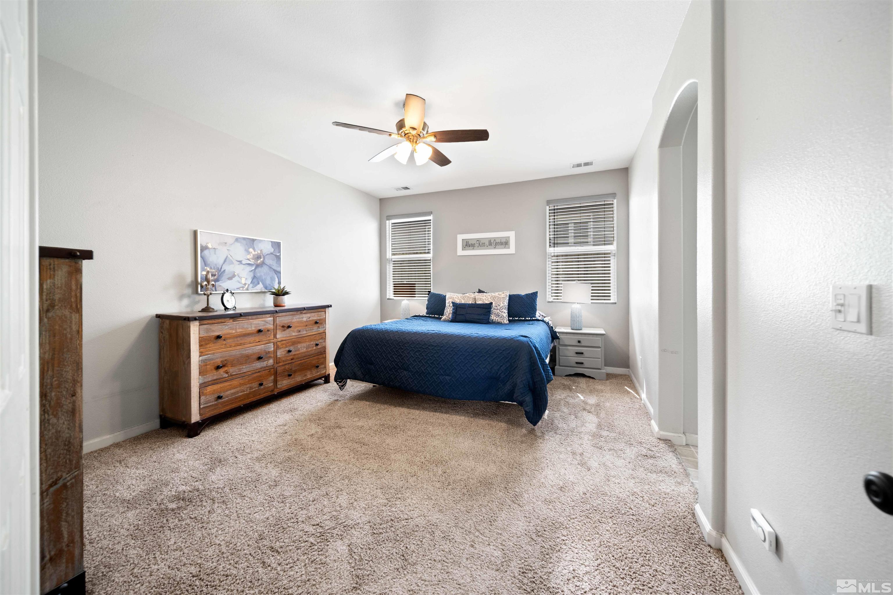 10599 Iron Point Circle Reno, NV 89521 - Photo 17 of 39 a bedroom with furniture and window