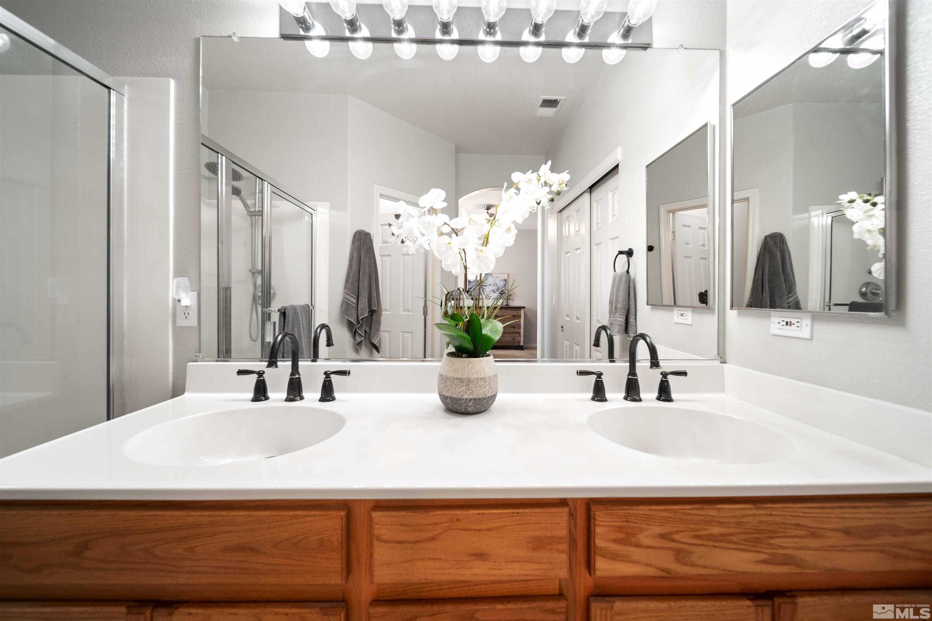 10599 Iron Point Circle Reno, NV 89521 - Photo 20 of 39 a bathroom with a sink and a mirror
