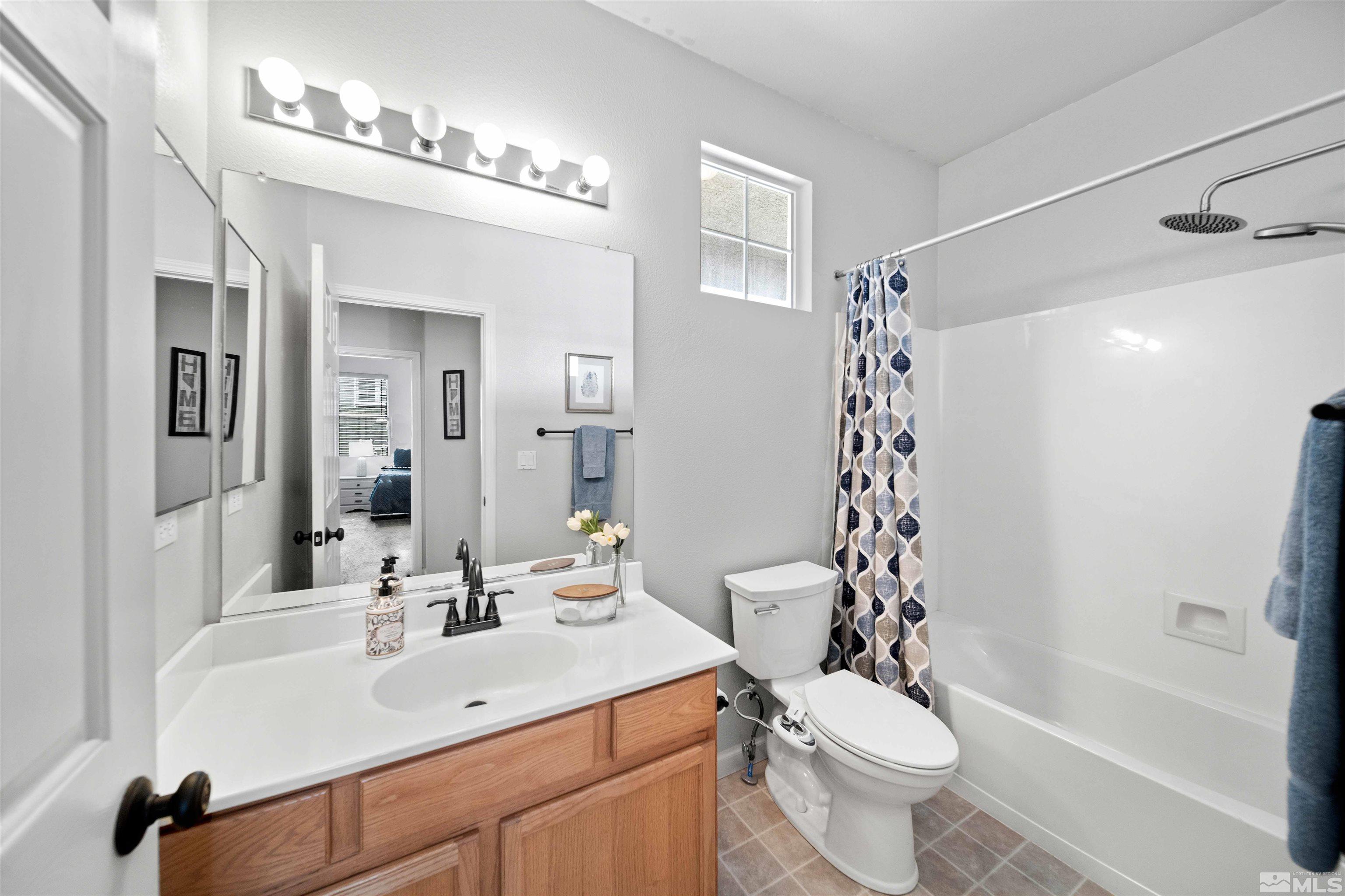10599 Iron Point Circle Reno, NV 89521 - Photo 23 of 39 a bathroom with a sink toilet tub and shower