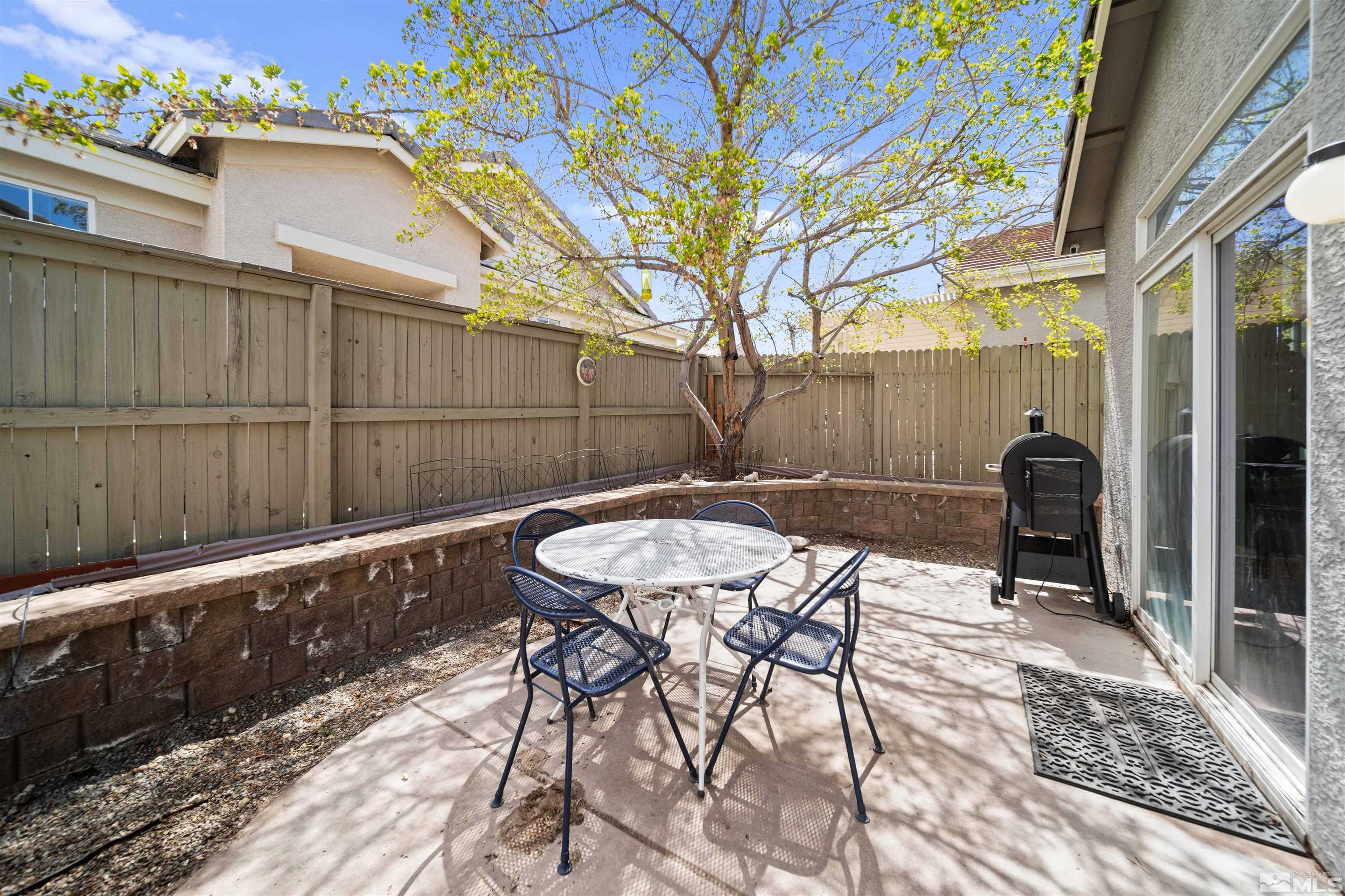 10599 Iron Point Circle Reno, NV 89521 - Photo 26 of 39 a view of a chairs and table in the patio