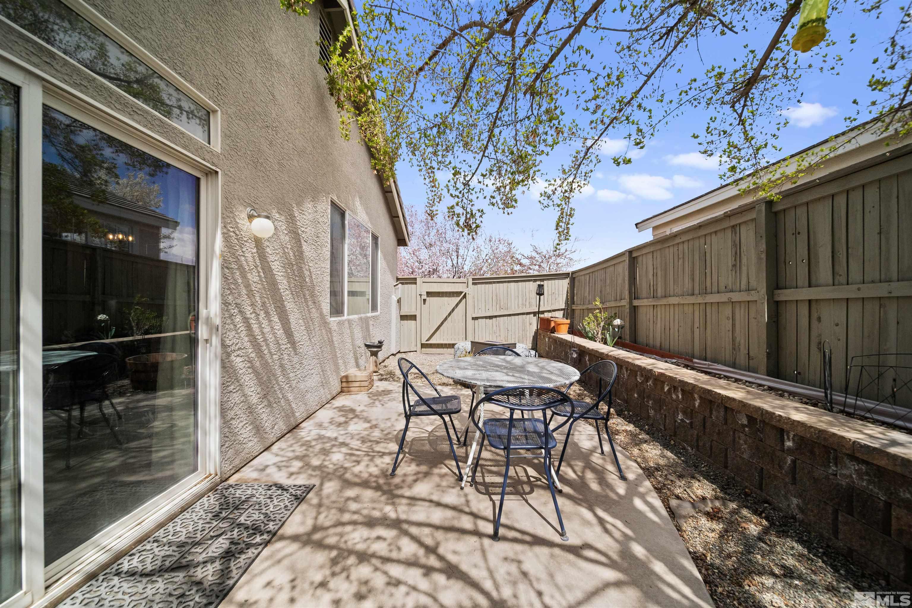 10599 Iron Point Circle Reno, NV 89521 - Photo 27 of 39 a balcony with chairs and with an outdoor space