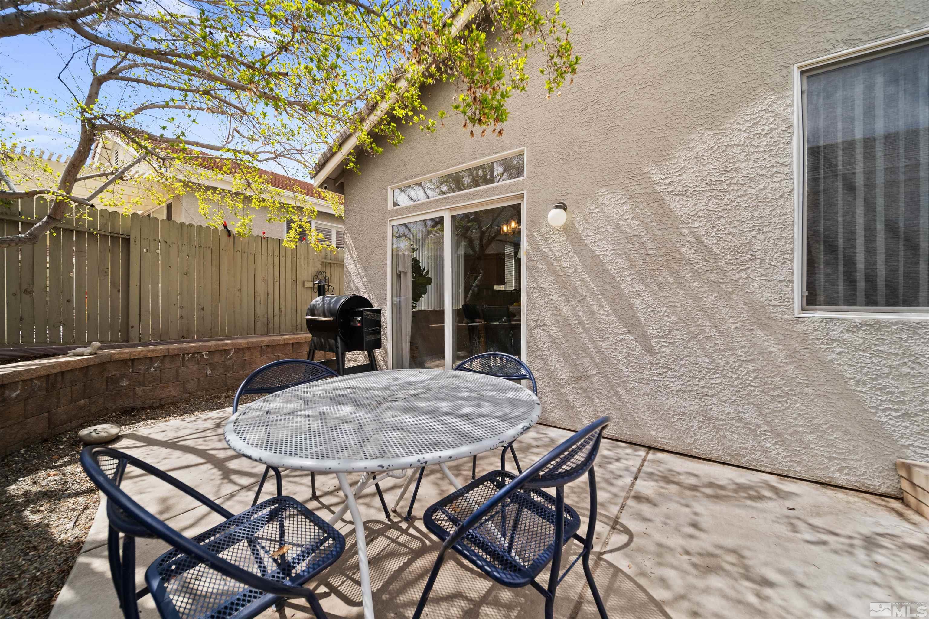 10599 Iron Point Circle Reno, NV 89521 - Photo 29 of 39 a view of a table and chairs in patio