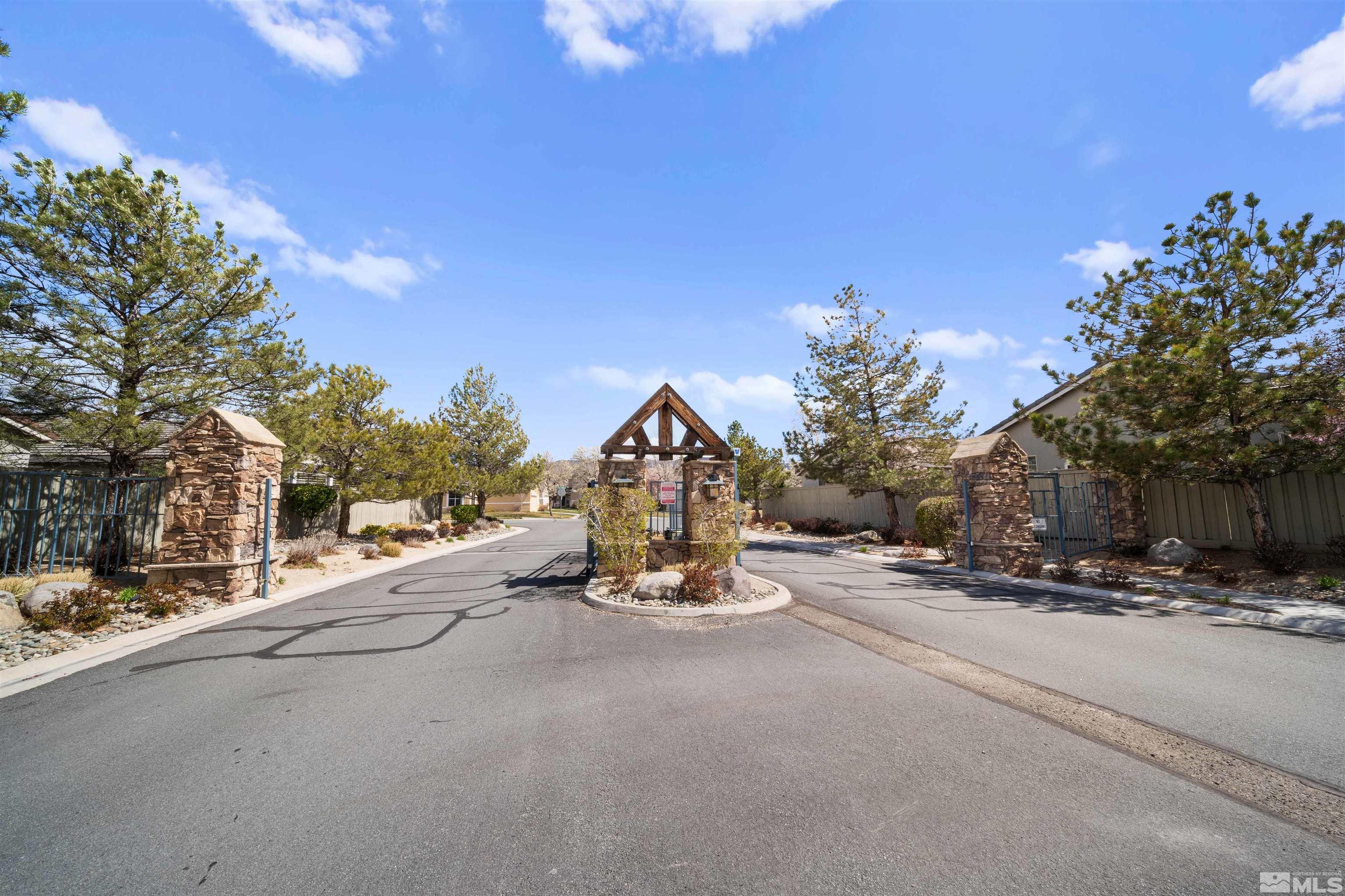 10599 Iron Point Circle Reno, NV 89521 - Photo 30 of 39 a view of a street with a building in the background