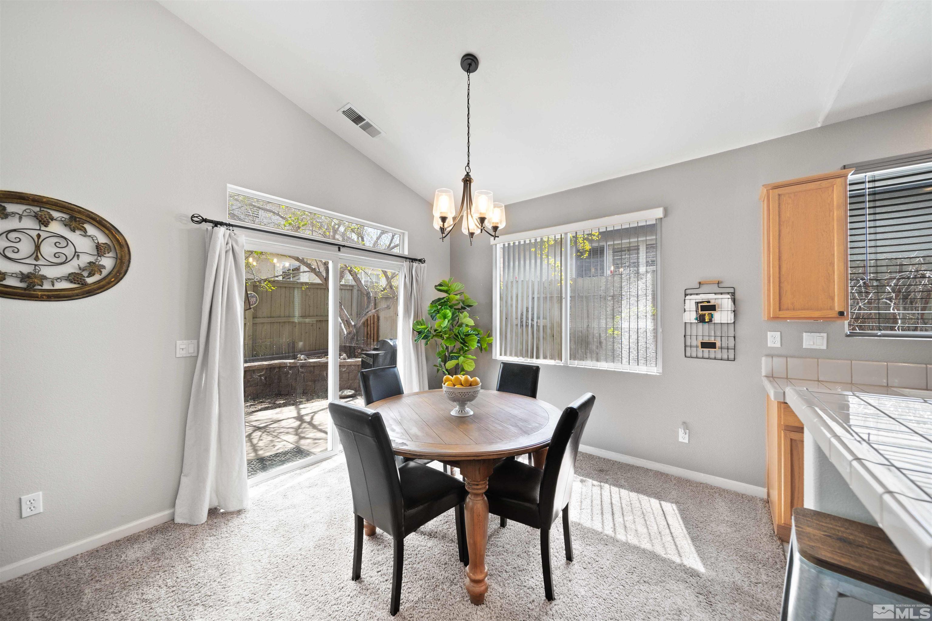 10599 Iron Point Circle Reno, NV 89521 - Photo 9 of 39 a dining room with furniture window and outside view