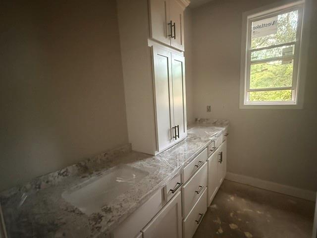 745 Mulberry Rock Road Temple, GA 30179 - Photo 11 of 33 a bathroom with a granite countertop sink and a window