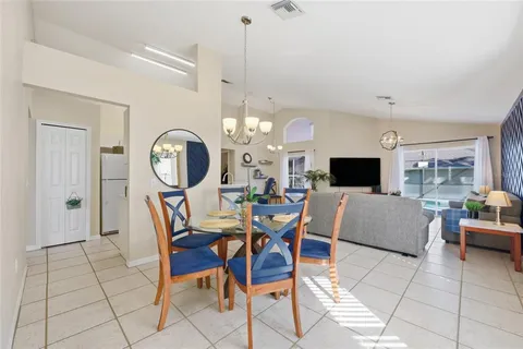 a kitchen with stainless steel appliances kitchen island sink refrigerator and stove