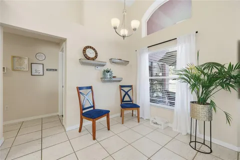 a bathroom with a sink a toilet and a large mirror