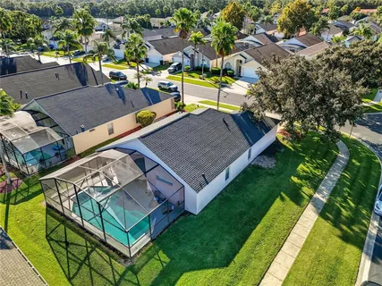 an aerial view of a house having swimming pool garden and patio