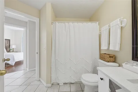 a bedroom with two beds and a window