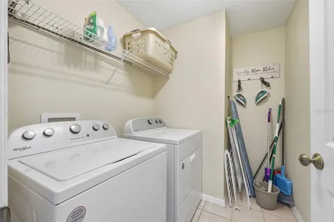 an aerial view of a house with a yard and lake view