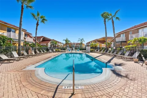 an aerial view of a house having swimming pool